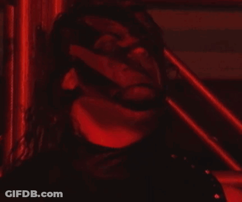 Man In Red And Black In Wrestling Ring With Pentagram GIF