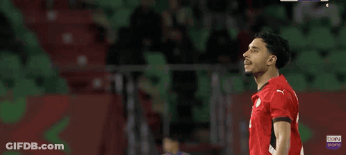 Man In Red And Black Jersey Number 4 Applauding GIF