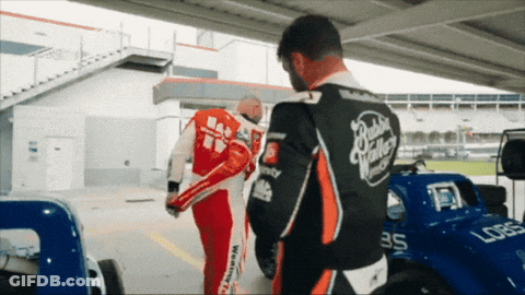 Man In Red And Black Racing Suit Number 35 GIF