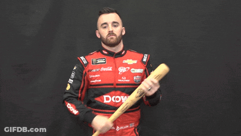Man In Red And Black Racing Uniform Holding Baseball Bat GIF