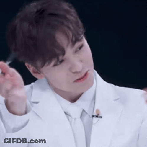 Man In Red And Black Shirt With White Leaf GIF