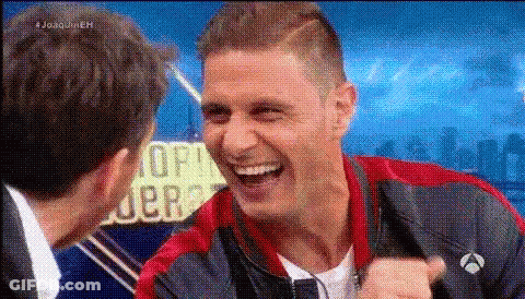 Man In Red And Blue Jacket Laughing With Another Man GIF