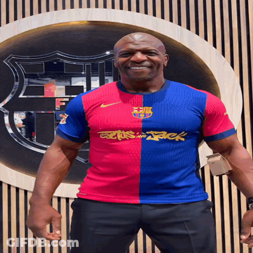 Man In Red And Blue Jersey With Stack GIF