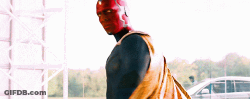 Man In Red And Blue Superhero Costume In Front Of Car GIF