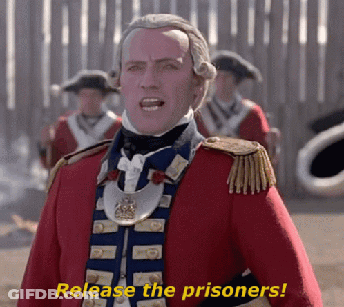 Man In Red And Blue Uniform Saying Release The Prisoners GIF