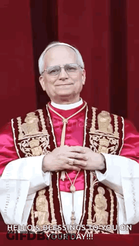 Man In Red And Gold Robe With Hands Folded GIF