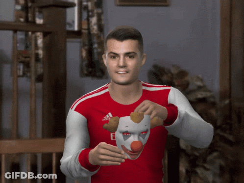 Man In Red And White Adidas Shirt Holding Clown Mask GIF