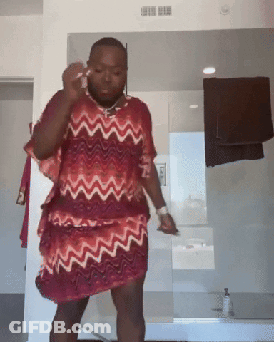 Man In Red And White Dress At Bathroom Mirror GIF