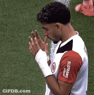 Man In Red And White Elotrans Jersey Praying On Field GIF
