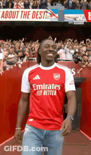Man In Red And White Emirates Fly Better Jersey Walking Down Tunnel GIF