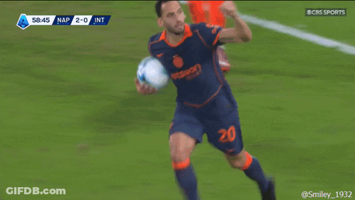 Man In Red And White Jersey Holding BVB Coin GIF