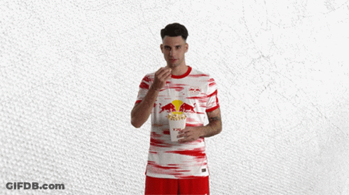 Man In Red And White Jersey With Bull GIF