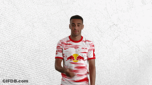 Man In Red And White Jersey With Red Bull GIF