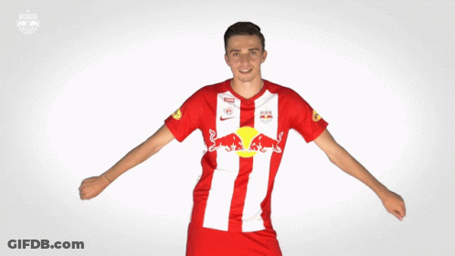 Man In Red And White Jersey With Red Bull Logo GIF