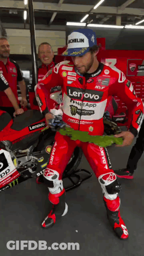 Man In Red And White Lenovo Monster Energy Racing Suit GIF