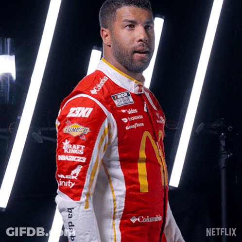 Man In Red And White McDonald's Racing Suit GIF