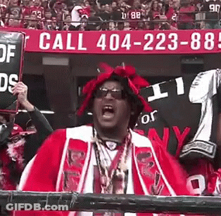 Man In Red And White Outfit Holding Sign Saying Call 404-223-88 GIF