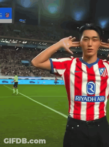 Man In Red And White Riyadh Air Soccer Jersey GIF