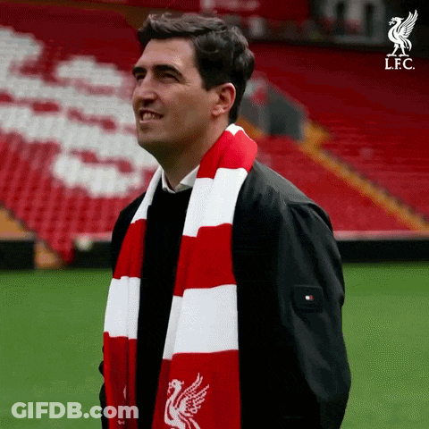 Man In Red And White Scarf With Liverpool Logo GIF