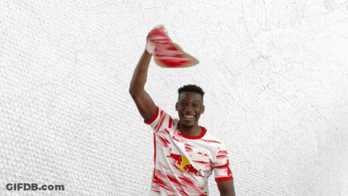 Man In Red And White Shirt Holding Scarf With Letter R GIF