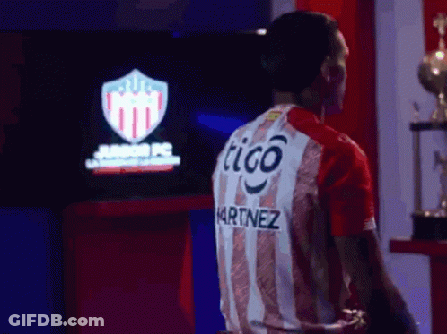 Man In Red And White Striped Shirt Saying Tigo Martinez GIF