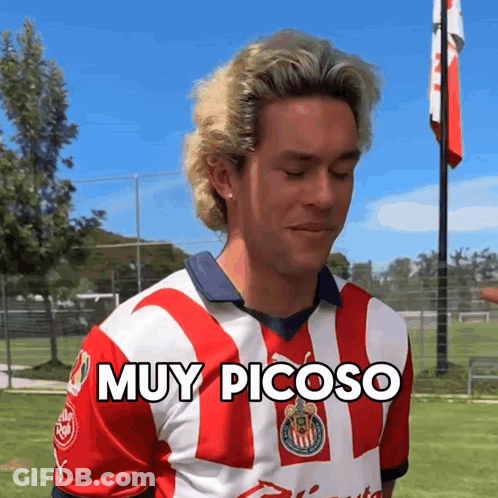 Man In Red And White Striped Shirt Says Muy Picoso GIF