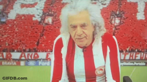 Man In Red And White Striped Shirt With Crowd GIF