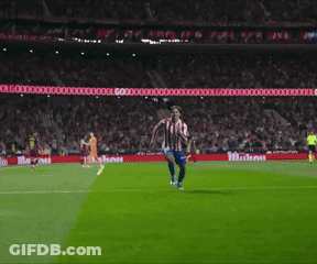 Man In Red And White Striped Shirt With Letter S Kneeling On Soccer Field GIF