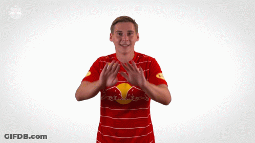 Man In Red And White Striped Shirt With Red Bull GIF
