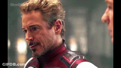 Man In Red And White Suit Talking To Another Man GIF