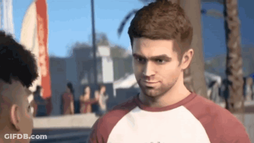 Man In Red And White T-Shirt Talking To Another Man GIF