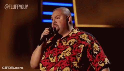Man In Red And Yellow Shirt Holding Microphone GIF