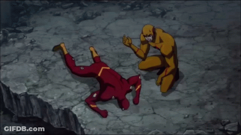 Man In Red And Yellow Superhero Costume Laying On Ground GIF