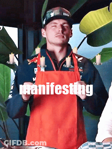 Man In Red Apron Holding Candles Manifesting GIF