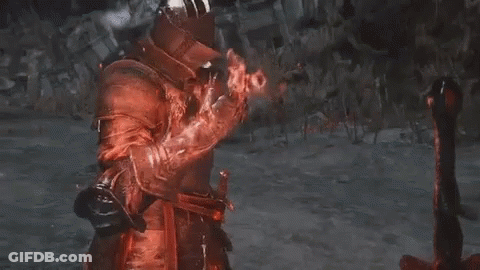Man In Red Armor And Helmet Holding Sword GIF