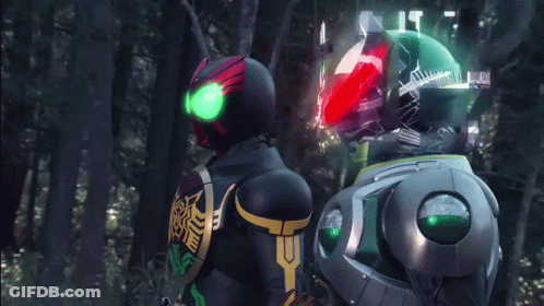 Man In Red Armor Next To Robot GIF