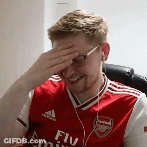 Man In Red Arsenal Jersey Covering Face Headphones GIF