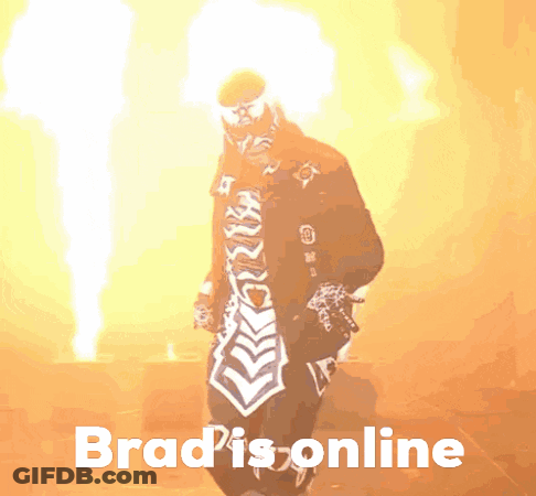 Man In Red Arsenal Jersey Covering Face With Hand And Headphones GIF
