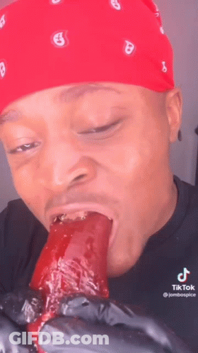 Man In Red Bandana Eating Long Food GIF