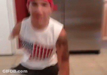 Man In Red Bandana Sitting On Kitchen Floor GIF