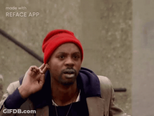Man In Red Beanie Making Funny Face With Fingers In Ears GIF