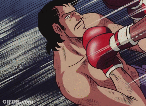 Man In Red Boxing Gloves Being Hit GIF
