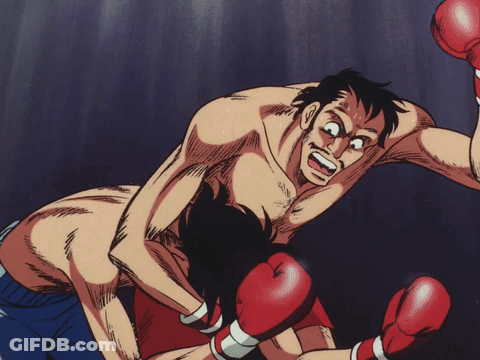 Man In Red Boxing Gloves Being Punched GIF
