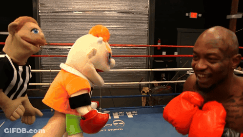 Man In Red Boxing Gloves In Ring GIF