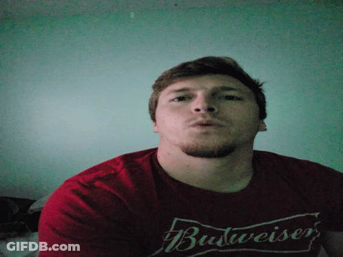 Man In Red Budweiser Shirt Looking Down GIF