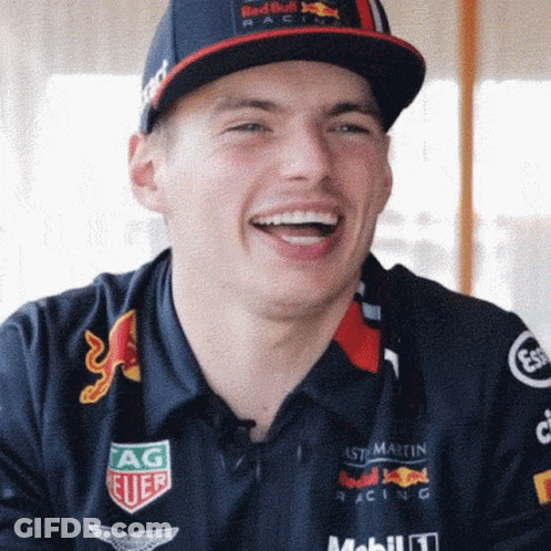 Man In Red Bull Hat And Polo Shirt Smiling GIF