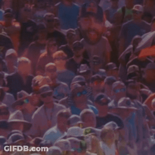 Man In Red Bull Hat Smiling At Crowd GIF