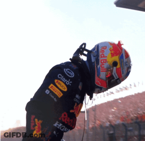 Man In Red Bull Helmet And Claro Shirt GIF