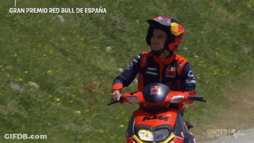 Man In Red Bull Helmet Riding Motorcycle GIF