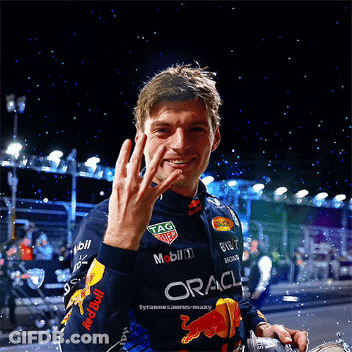 Man In Red Bull Racing Jacket Waving GIF